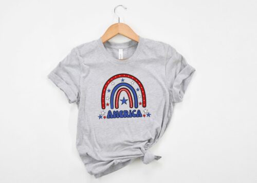 Bella + Canvas 3001 unisex T-shirt in athletic heather with a fun and vibrant red, white, and blue rainbow and “America” written in a retro font