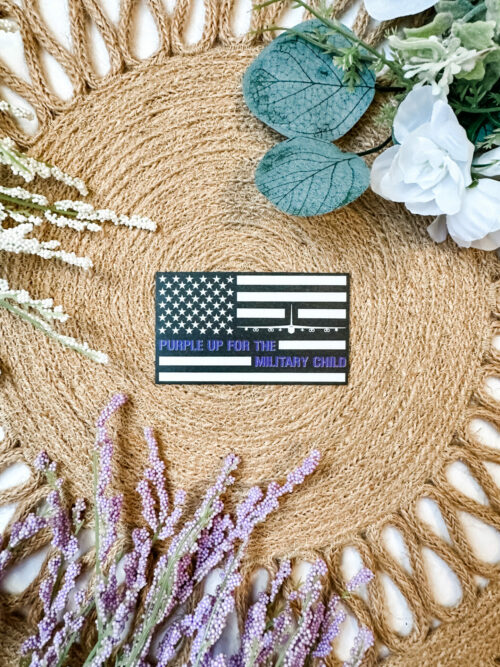 Black and White US Flag sticker featuring a B-52 Bomber and the saying, “Purple up for the military child”