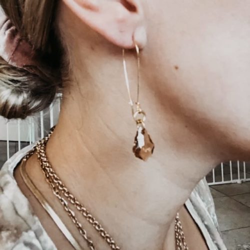 kayla topaz gold drop earring displayed on model