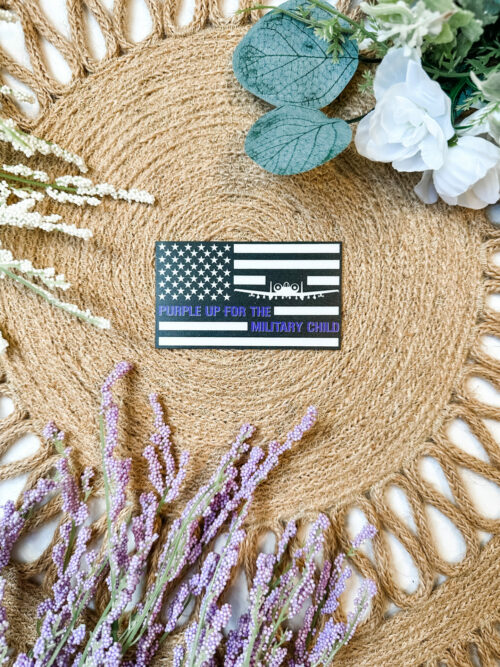 Black and White US Flag sticker featuring an A-10 and the saying, “Purple up for the military child”