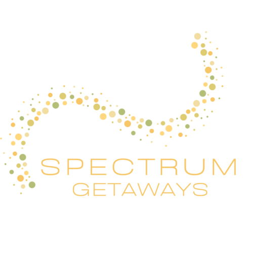 The Logo of Spectrum Getaways. It has a S shaped swirl with yellow and green dots making up the swirl.