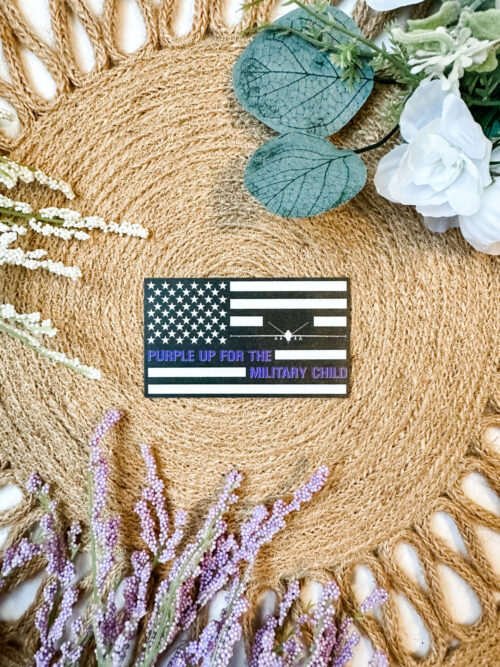 Black and White US Flag sticker featuring an MQ-9 Reaper and the saying, “Purple up for the military child”