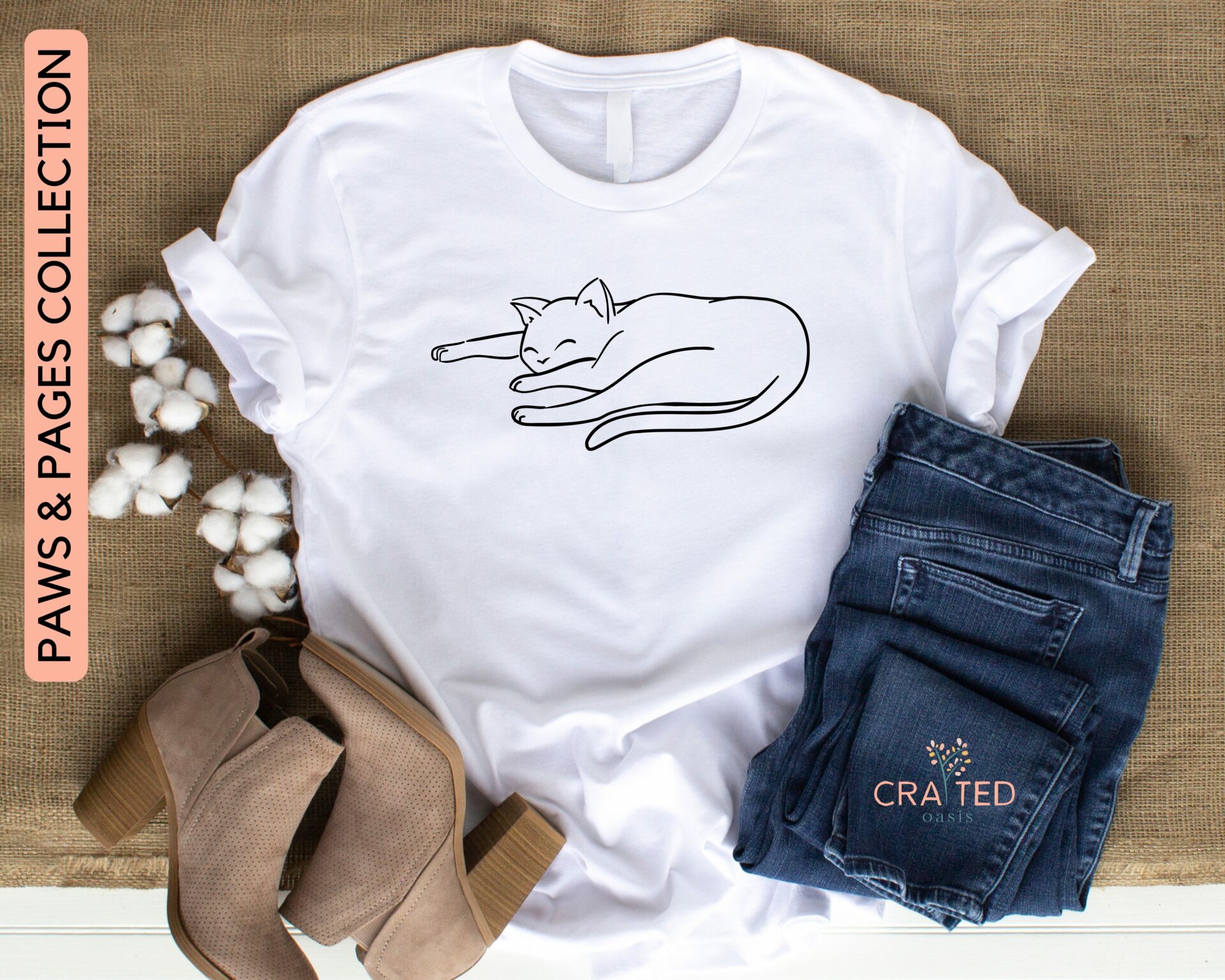 Bella and Canvas Unisex Tee featuring a paws and print doodle outline of curled up sleeping cat.
