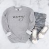 Gildan SF000 sweatshirt in sport grey with “navy” written in black hand lettering