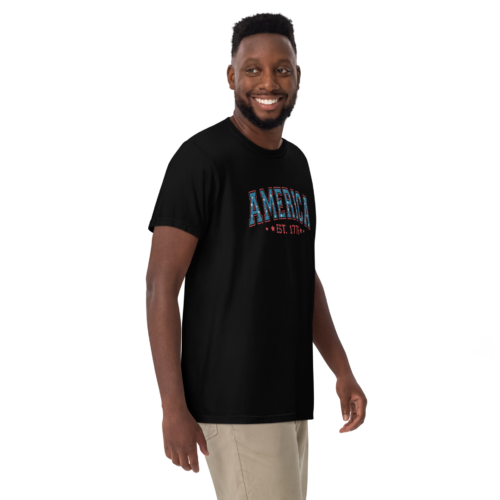 Comfort Colors C1717 t-shirt in black with “America, Est. 1776” in a muted, red, white, and blue distressed color scheme