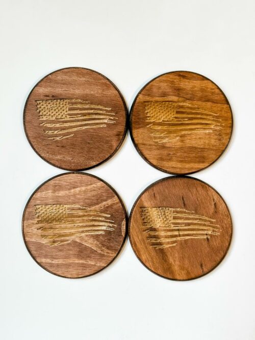 Circle coasters made from pine and laser engraved with a distressed US flag.