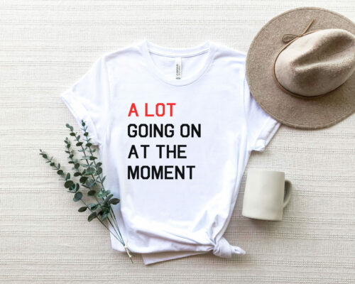 Bella Canvas 3001 unisex adult white T-shirt with saying, “A lot going on at the moment.” Show off your Swiftie Love!