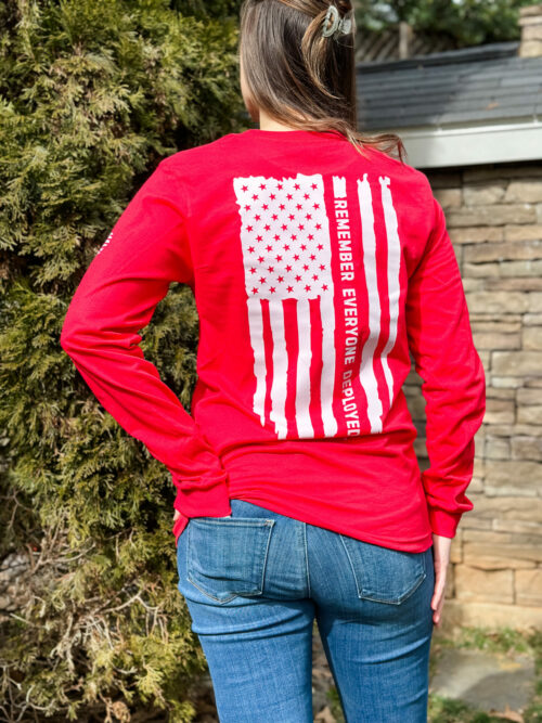 Bella Canvas 3501 long sleeve shirt in red with white flag on back saying, “Remember everyone deployed.”